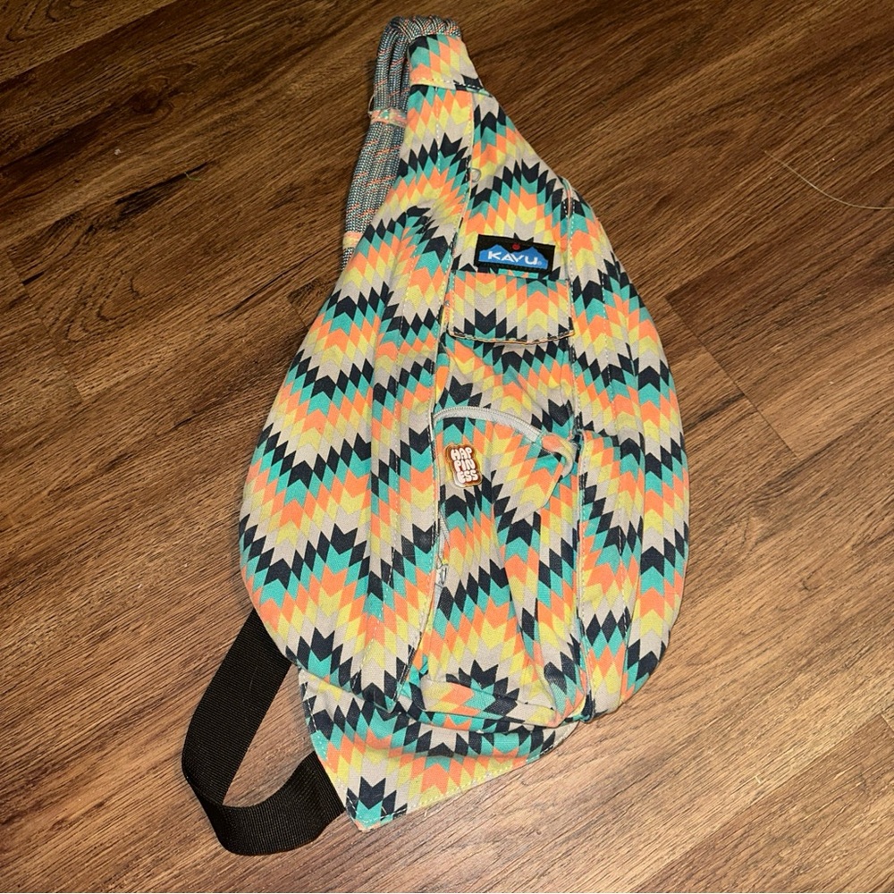 Kavu Chevron Sling Bag in Orange, Yellow, and Black